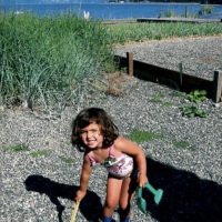 Ava Stoughton as a child on the beach